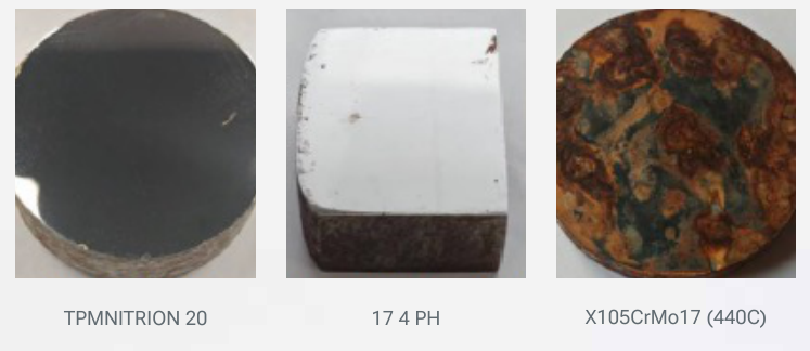 Specimens after the 480 h salt spray test: TPM NITRION 20 (left) compared with 17-4 PH (middle) and X105CrMo17 (440C) (right), TPM NITRION 20 showing visibly less corrosion